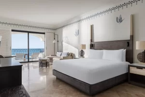 picture of a room with double bed and sea view balcony