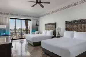 picture of two double beds and sea view balcony