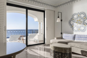 picture of a living area in a room with a sea view from the balcony