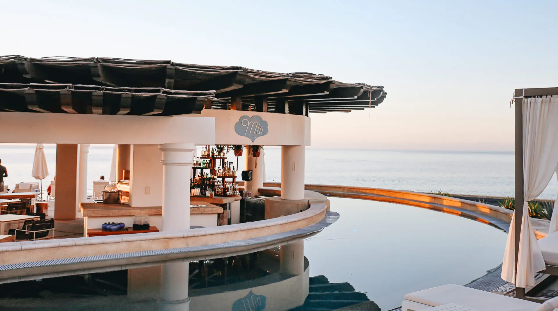 picture of a restaurant in the middle of a pool with sea view