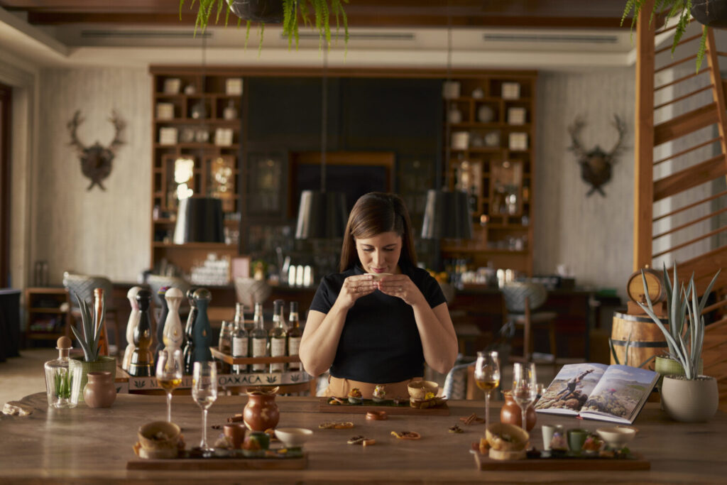 A girl tasting Agave at La Biblioteca of Hilton Los Cabos